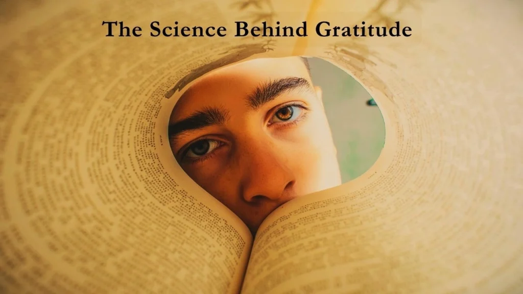 A man looking through pages of a book to denote the science behind the power of gratitude