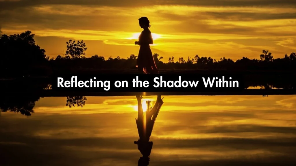 A woman walking in the shadows on the beach reflecting on shadow work.